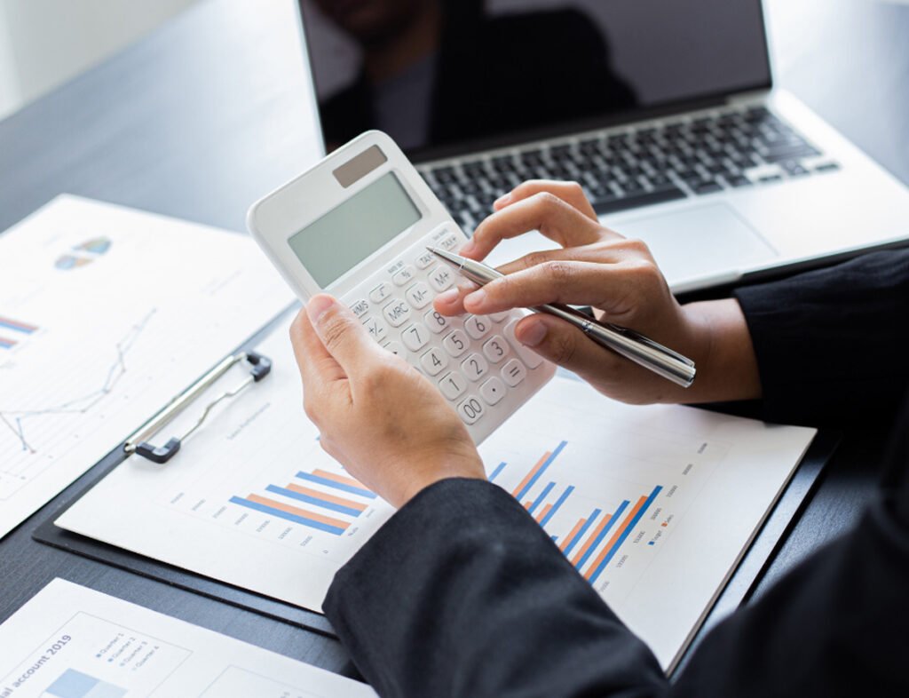 Advisor calculating business loan figures