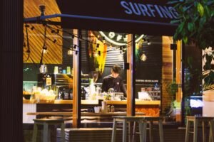 a small business owner still in his small cafe at night all alone