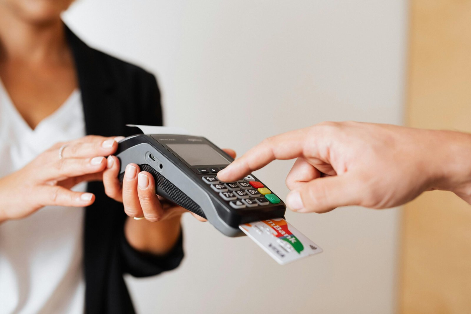 a person paying through credit card typing his passcode