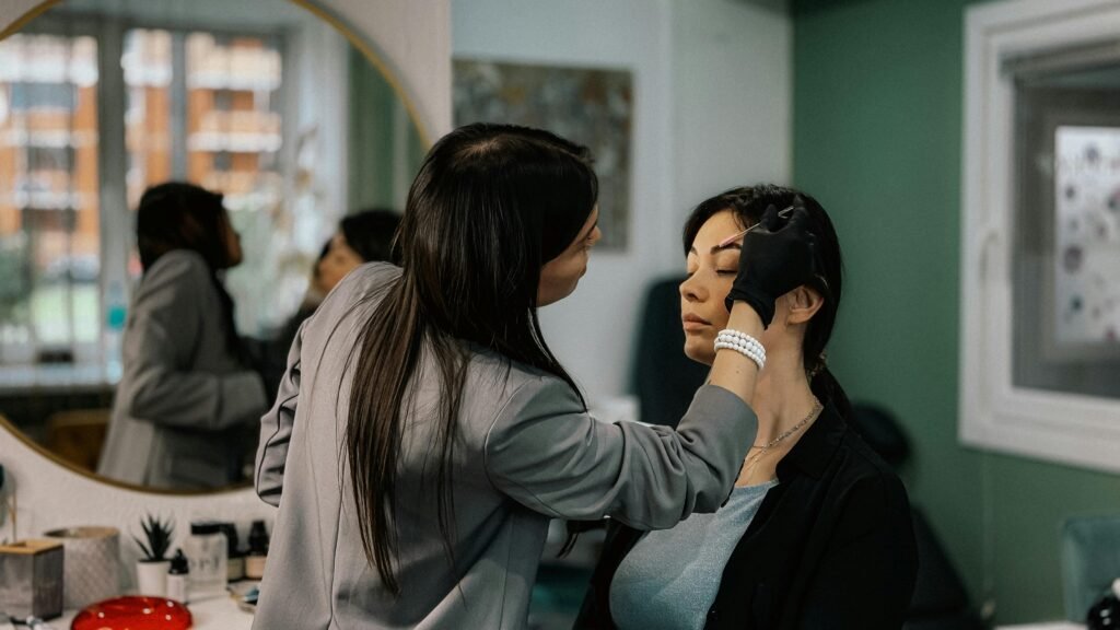a woman servicing her customer in her own salon