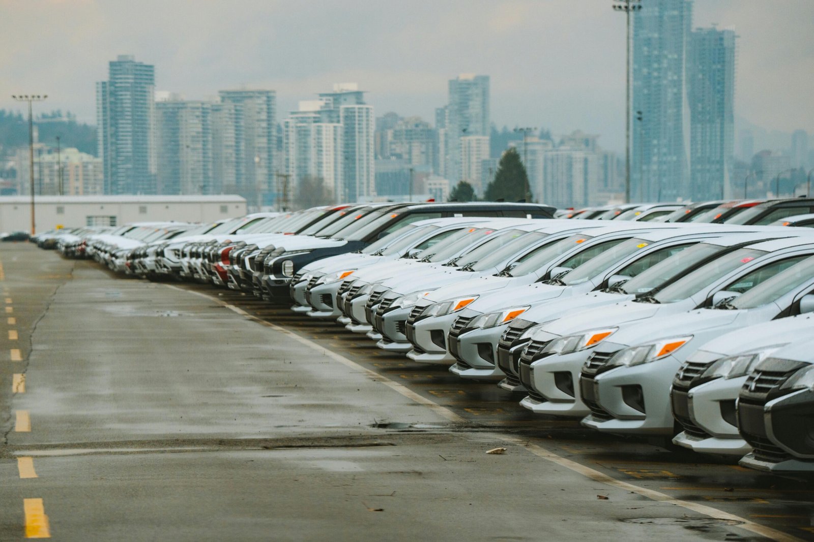 a line of gray cars parked
