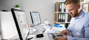 Business owner reviewing invoices and cash flow